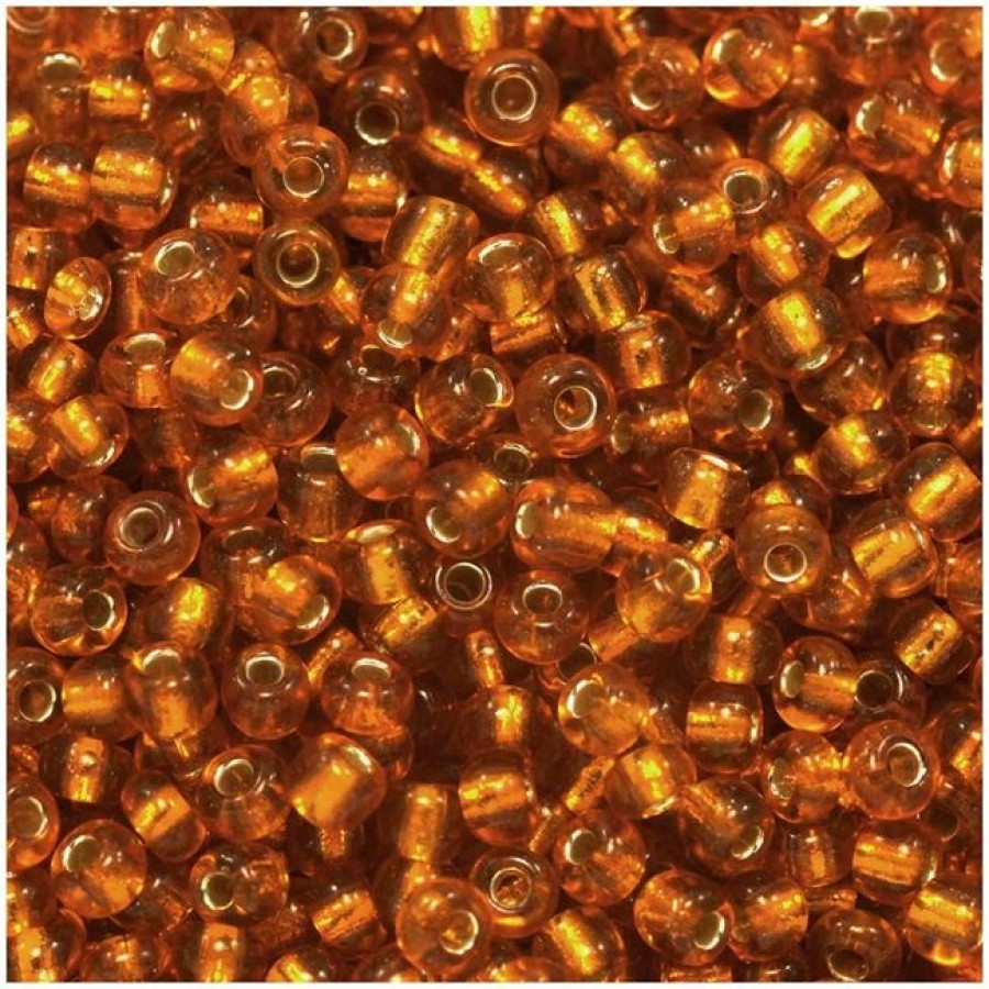 Γυάλινη χάντρα ροκάι No8 (~2,9mm) σε σκούρο πορτοκαλί διάφανο χρώμα, κατάλληλη για την κατασκευή κοσμημάτων-τιμή ανά συσκευασία 20 γραμμ.