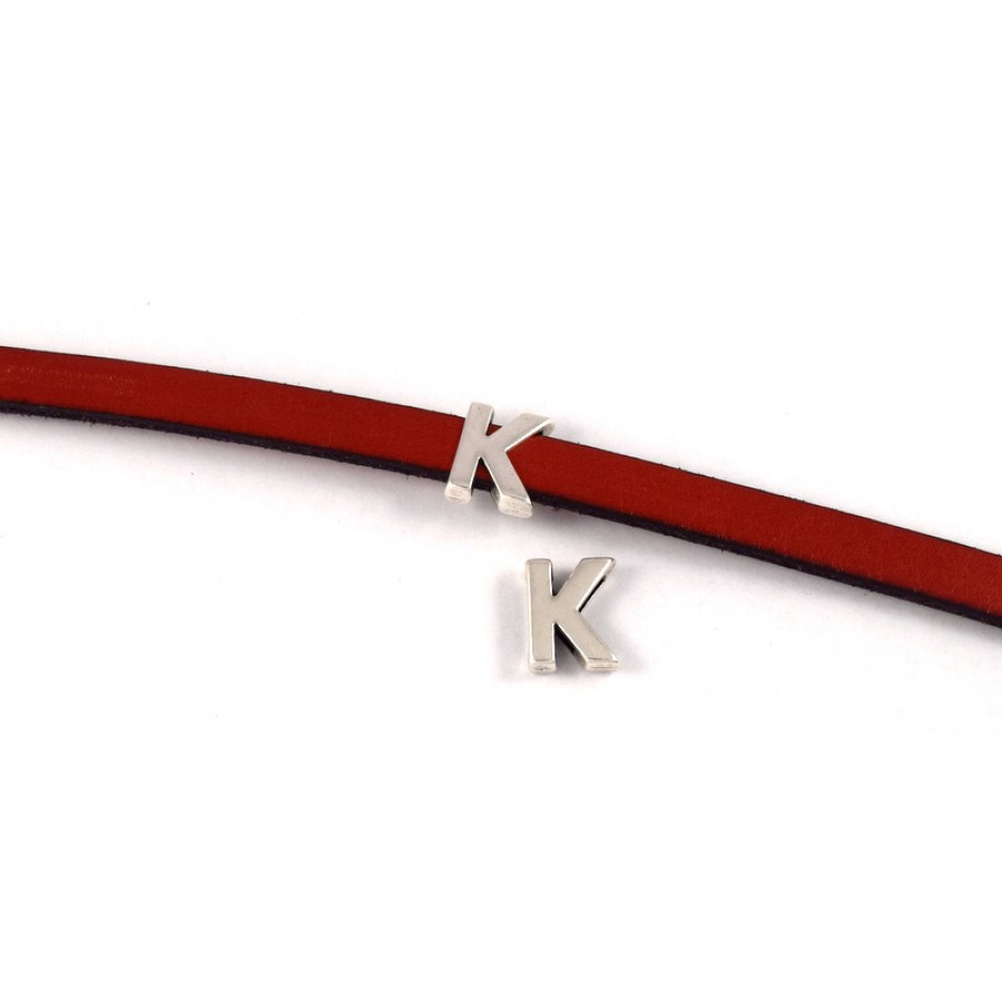 Περαστό γράμμα ''K'' 15mm  σε ασημί αντικέ κατάλληλο για πλακέ κορδόνι 10x2mm τιμή ανα τεμάχιο