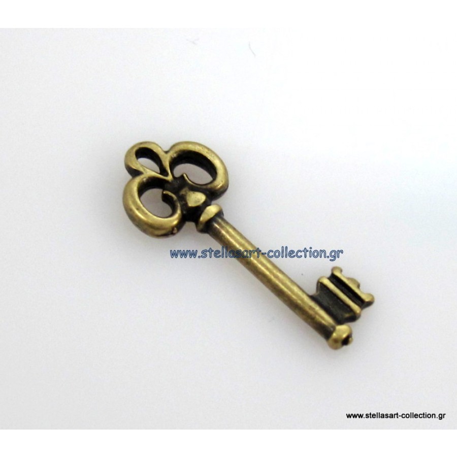 Mεταλλικό μοτίφ μικρό κλειδί 9,6 x 24,3 mm σε μπρονζέ     τιμή ανα τεμάχιο