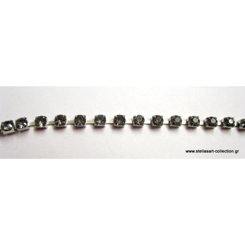 Τρέσα με  διάφανα γκρι κρυσταλάκια φάρδους 3mm     τιμη ανα μισό μέτρο